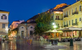 Syntagma Square of Nafplio with castle at night.