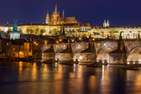 Prague Castle above Charles Bridge and the Moldau reflecting light