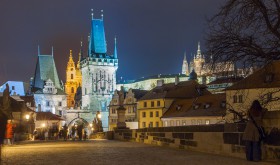 Lesser Town Bridge Tower at the end of the Charles Bridge in Prague nicely illuminated at night.
